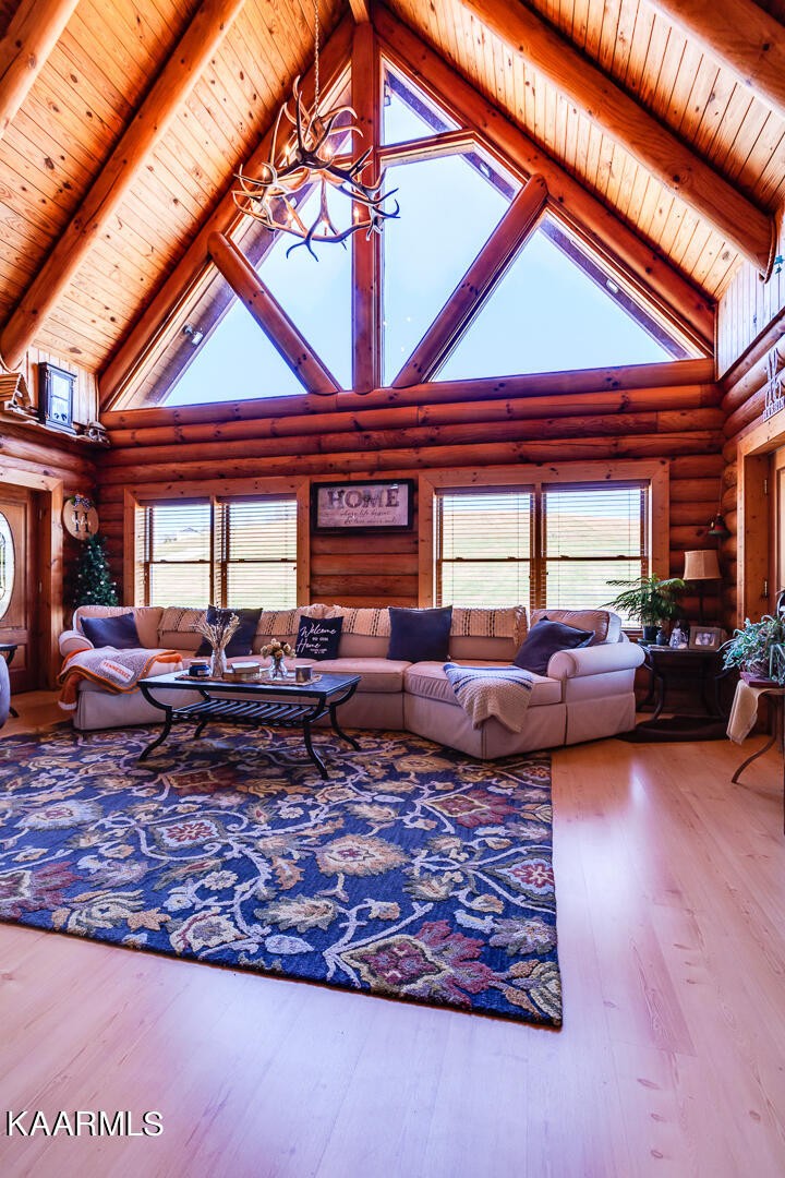 2030 Holston River Drive Rutledge, TN 37861 - Photo 6 of 53 a living room with furniture a rug and a large window