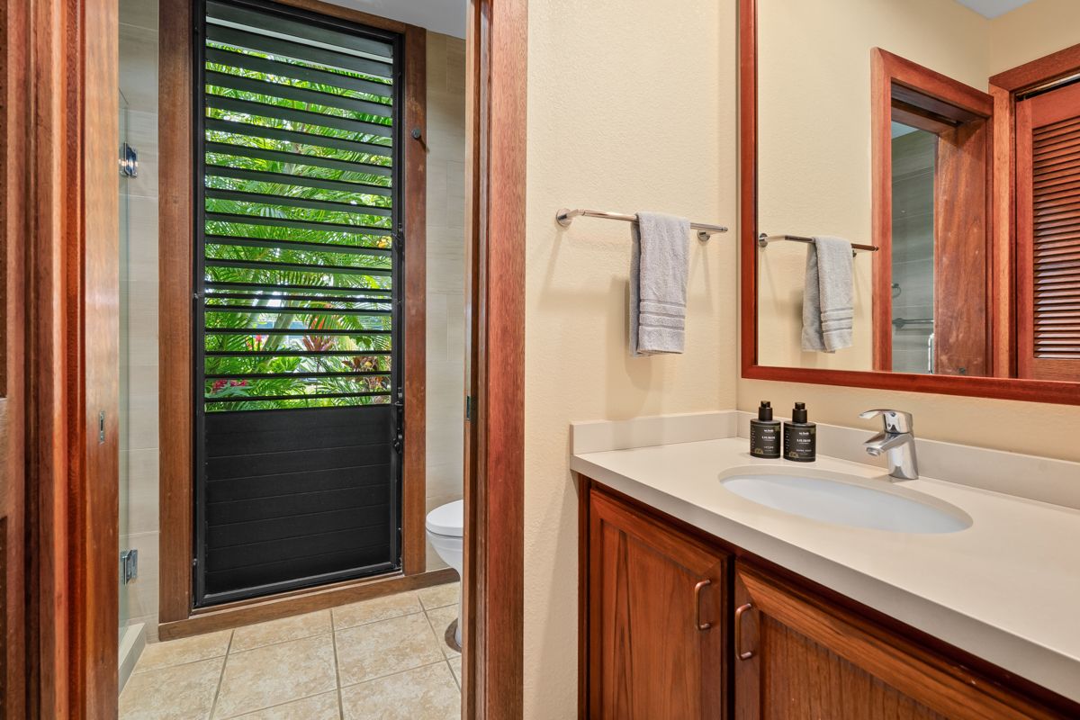 2221 Kapili Road, Unit 6 Koloa, HI 96756 - Photo 12 of 27 a bathroom with a sink and a mirror