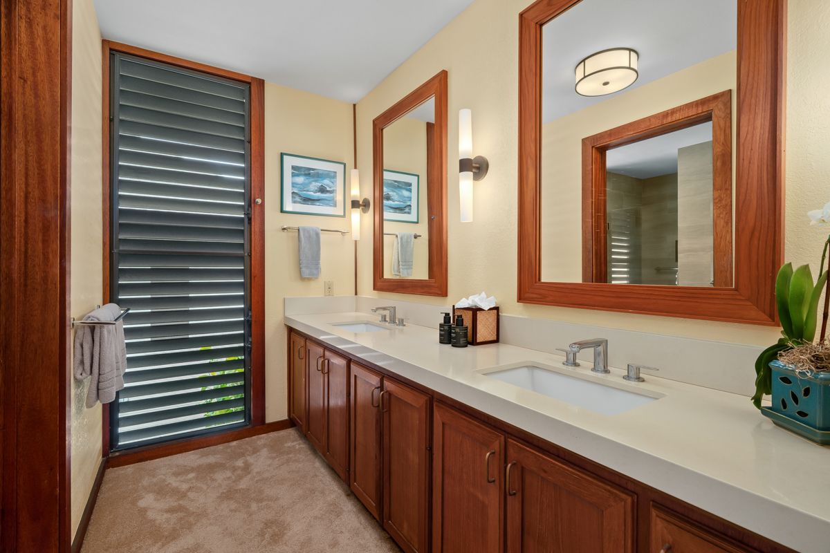 2221 Kapili Road, Unit 6 Koloa, HI 96756 - Photo 15 of 27 a bathroom with a sink and a mirror