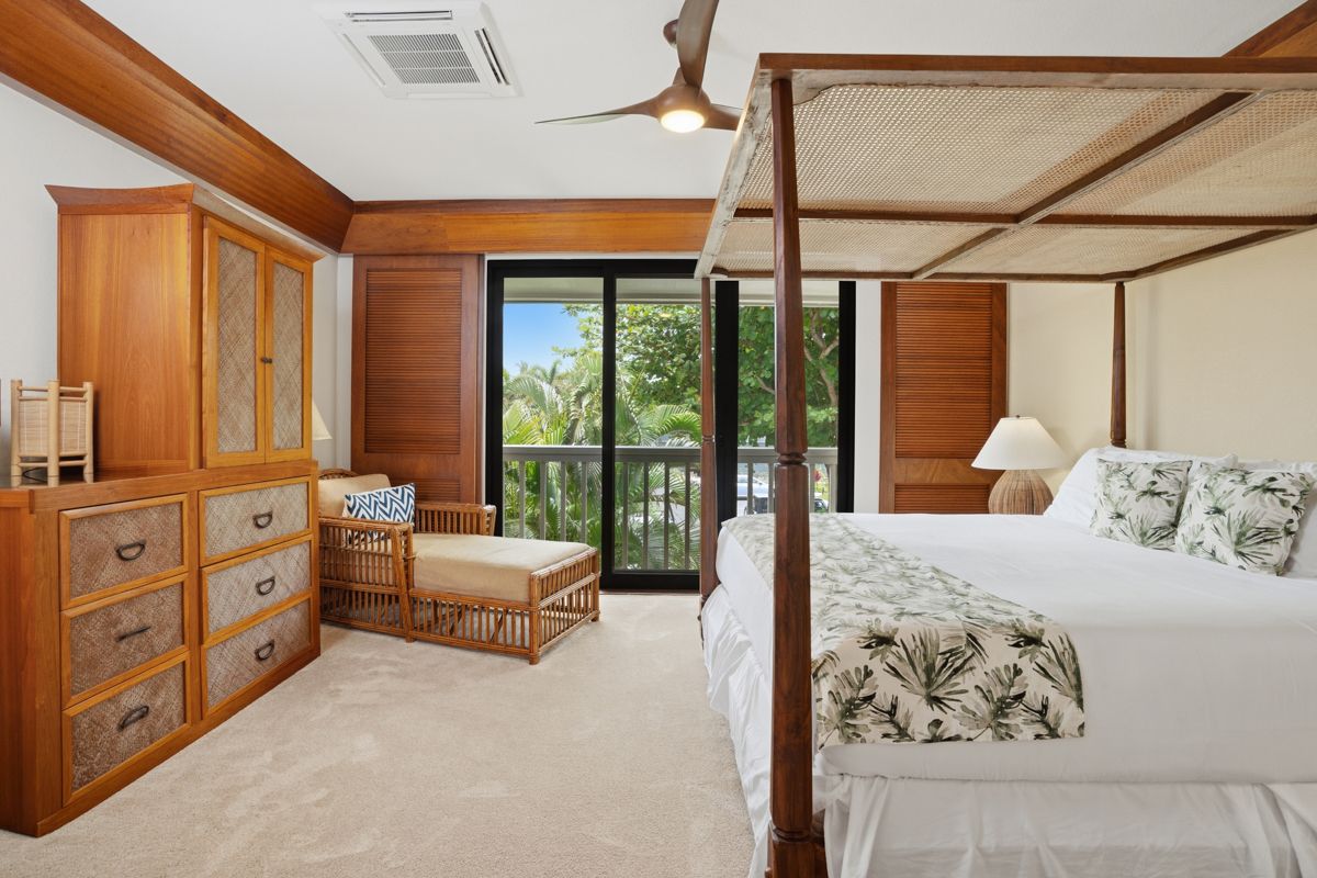 2221 Kapili Road, Unit 6 Koloa, HI 96756 - Photo 17 of 27 a bedroom with furniture and large windows