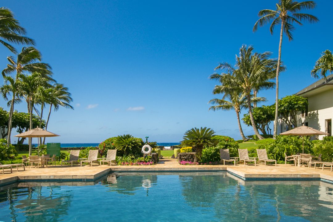 2221 Kapili Road, Unit 6 Koloa, HI 96756 - Photo 22 of 27 a front view of a house with yard and lake view