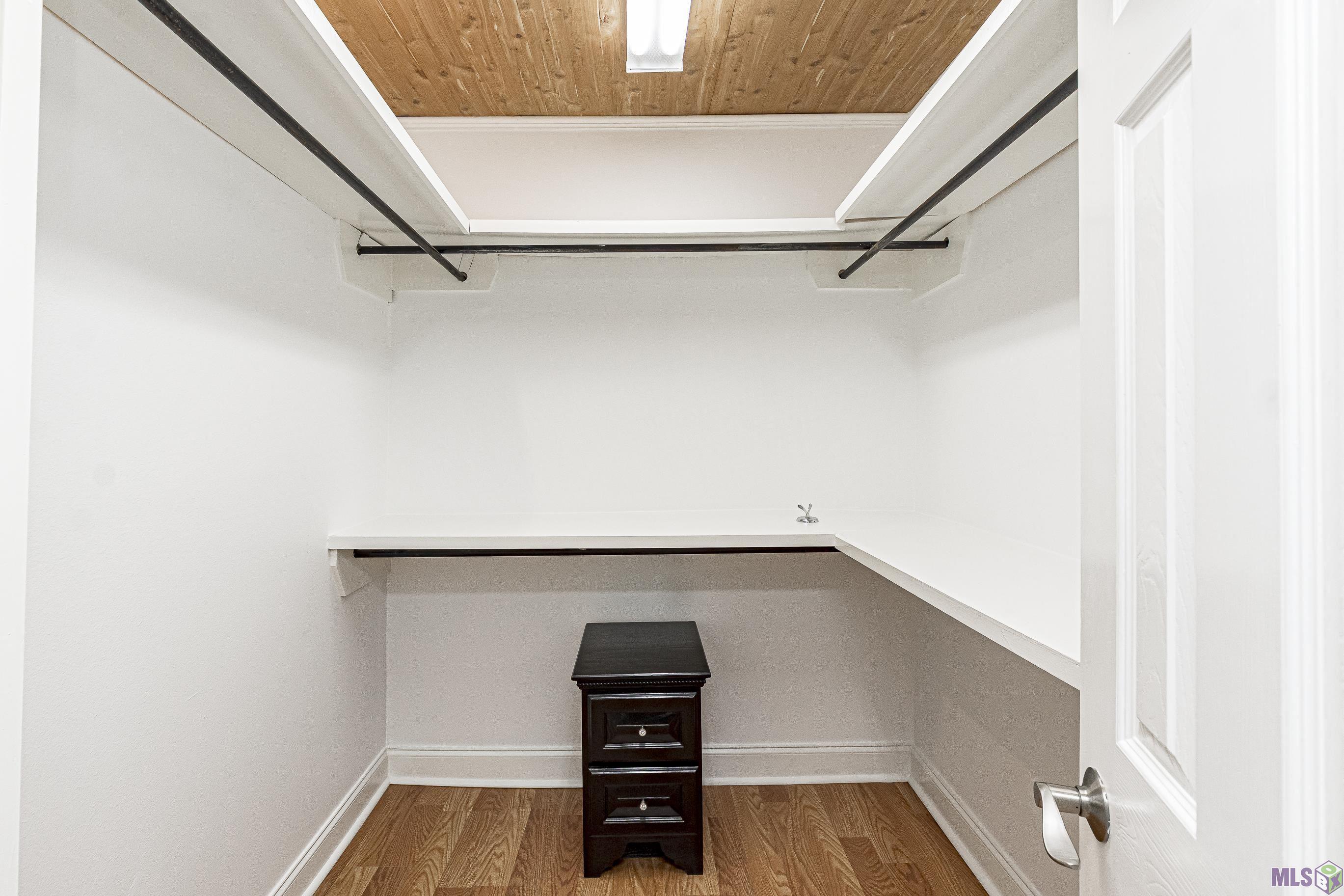 3105 Pen Street Baton Rouge, LA 70802 - Photo 15 of 23 PRIMARY BEDROOM CLOSET WITH PINEWOOD CEILING