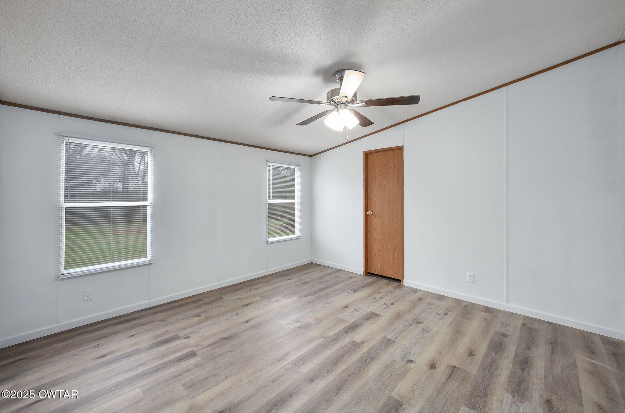 841 Turner Road Martin, TN 38237 - Photo 2 of 32 wooden floor in an empty room with a window