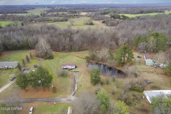 an aerial view of a houses with outdoor space