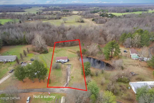 an aerial view of a houses with outdoor space