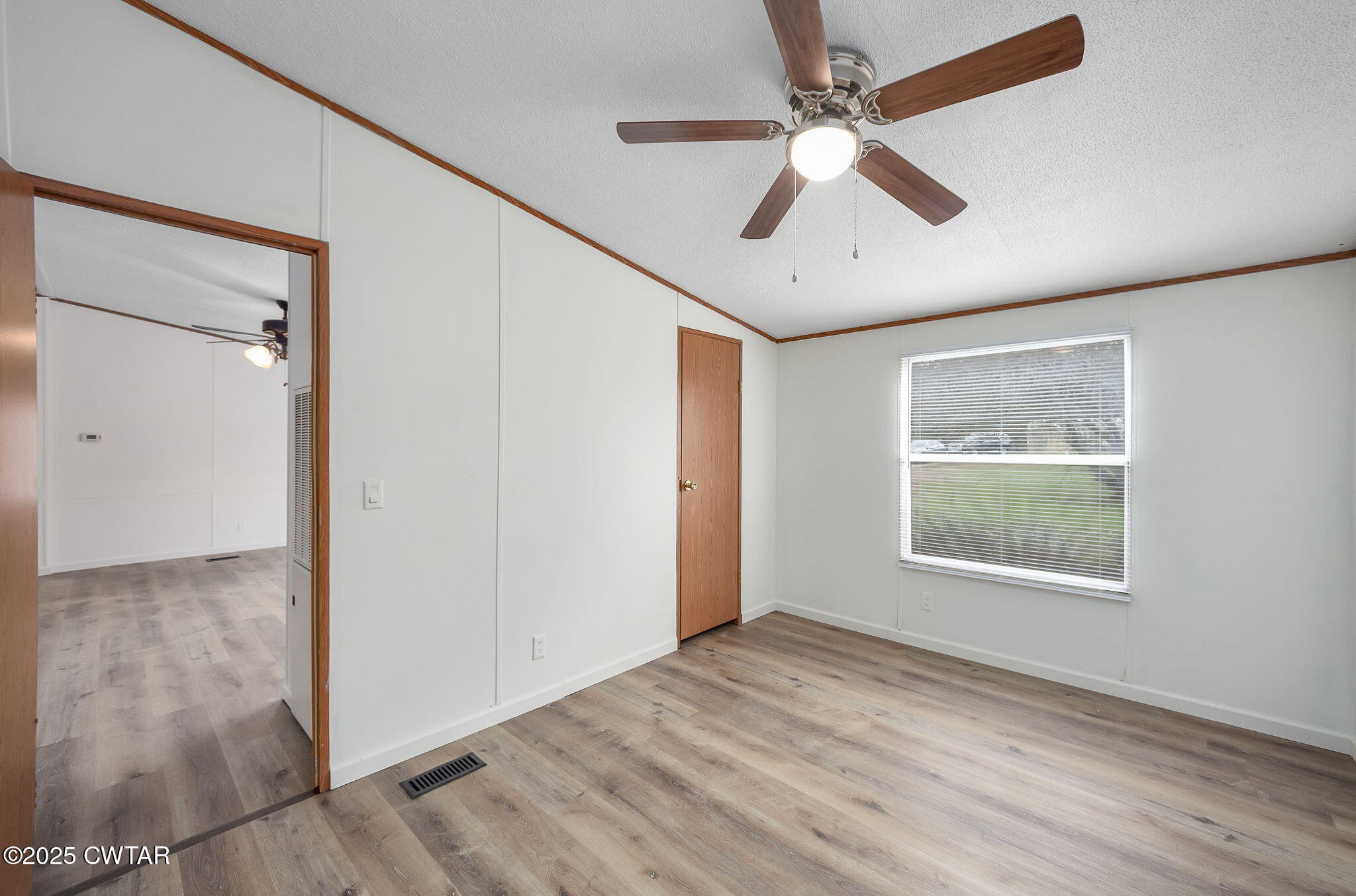 841 Turner Road Martin, TN 38237 - Photo 6 of 32 wooden floor in an empty room with a window