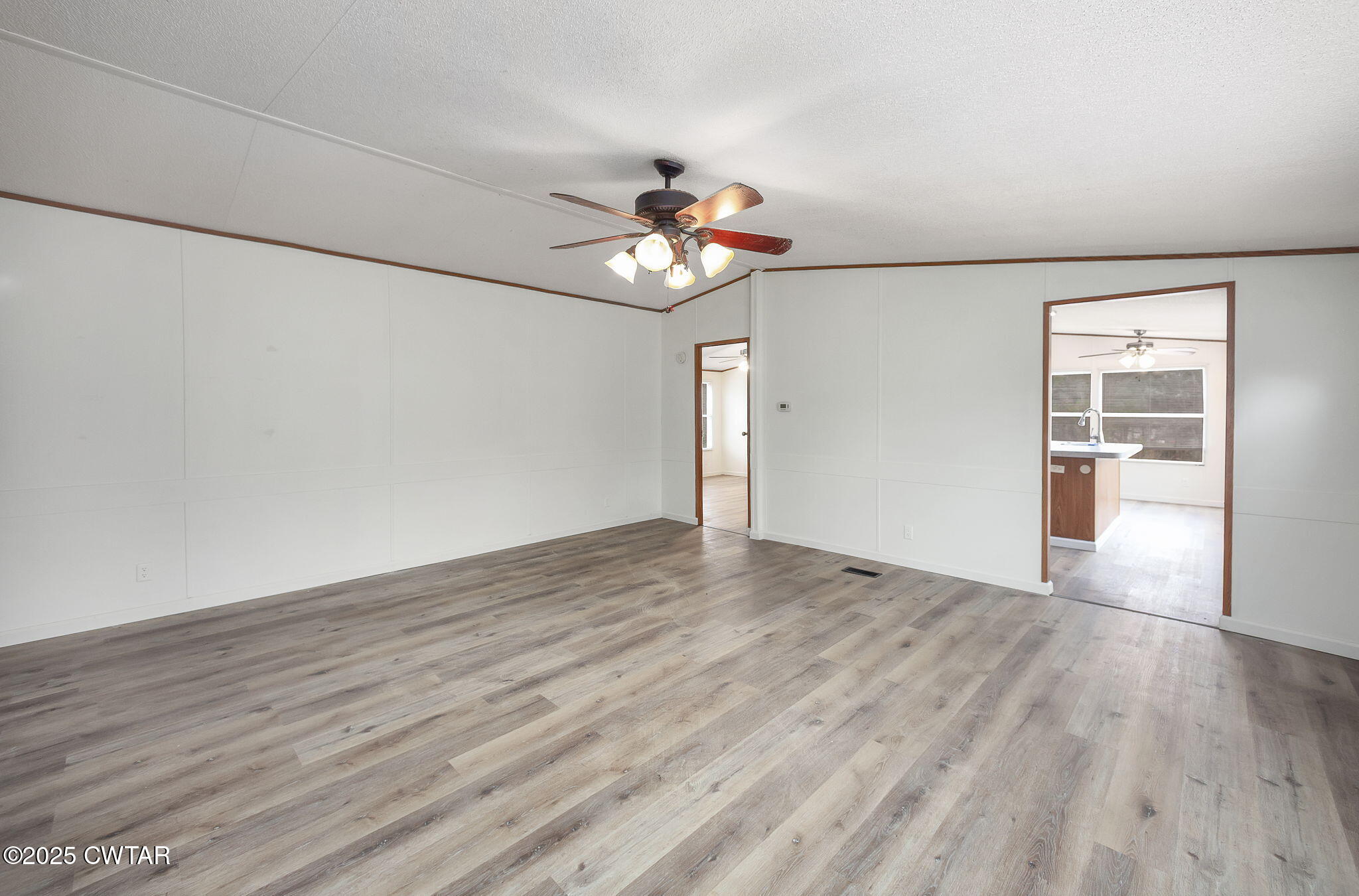 841 Turner Road Martin, TN 38237 - Photo 9 of 32 a view of an empty room with a window and wooden floor