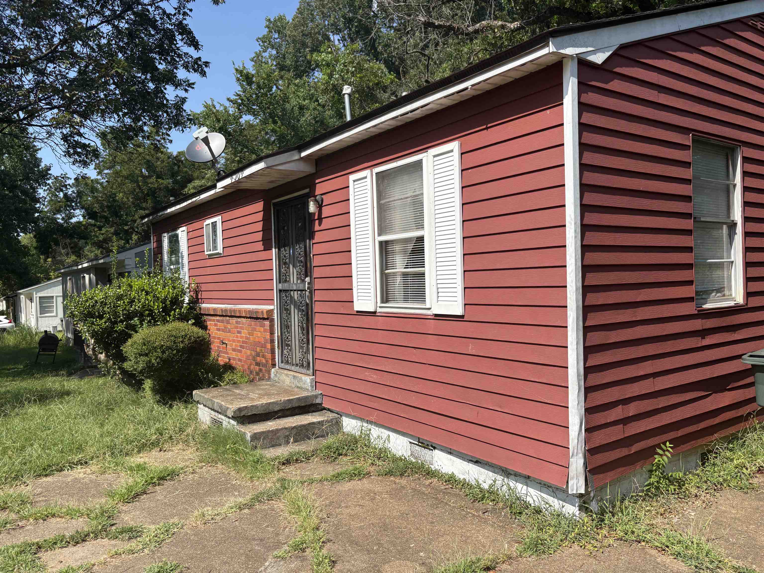 4364 Range Line Road Memphis, TN 38127 - Photo 3 of 15 a view of a house with a yard and plants