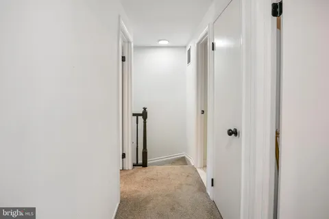 a view of a hallway with a room