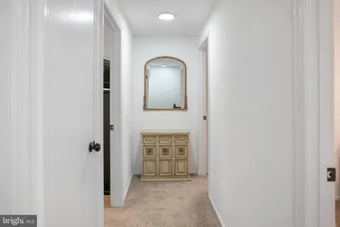a view of a hallway with front door
