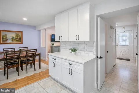 a view of kitchen with center island and stainless steel appliances