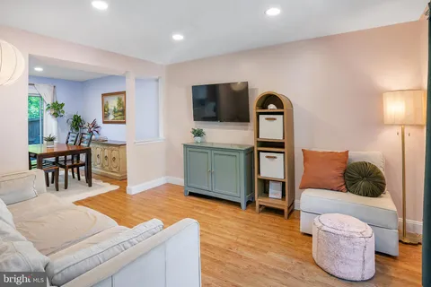 a living room with furniture and flat screen tv