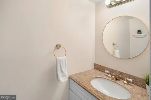 a bathroom with a sink and mirror