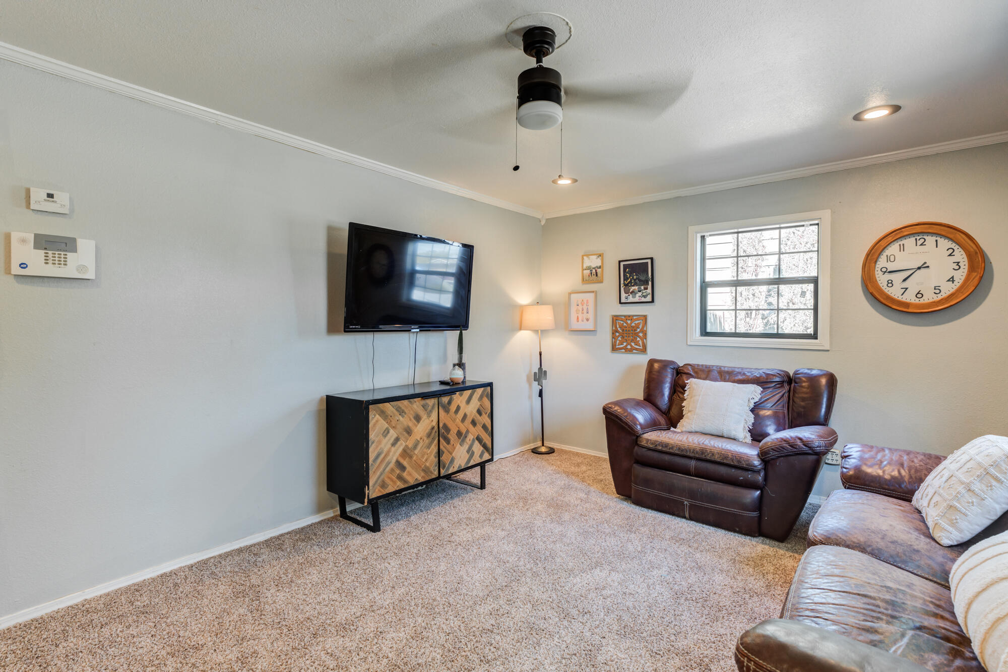 2019 40th Street Lubbock, TX 79412 - Photo 11 of 33 a living room with furniture and a flat screen tv