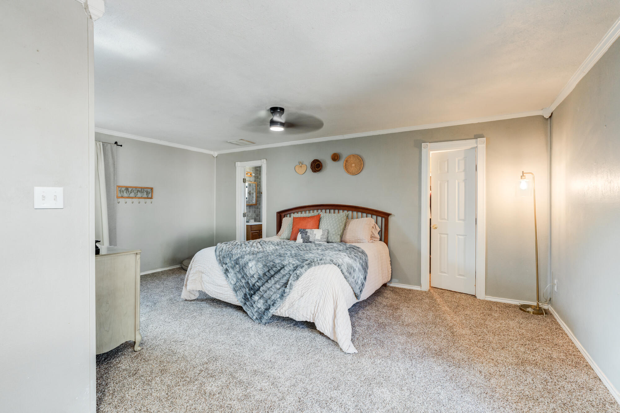 2019 40th Street Lubbock, TX 79412 - Photo 17 of 33 a bedroom with a bed and a painting on the wall