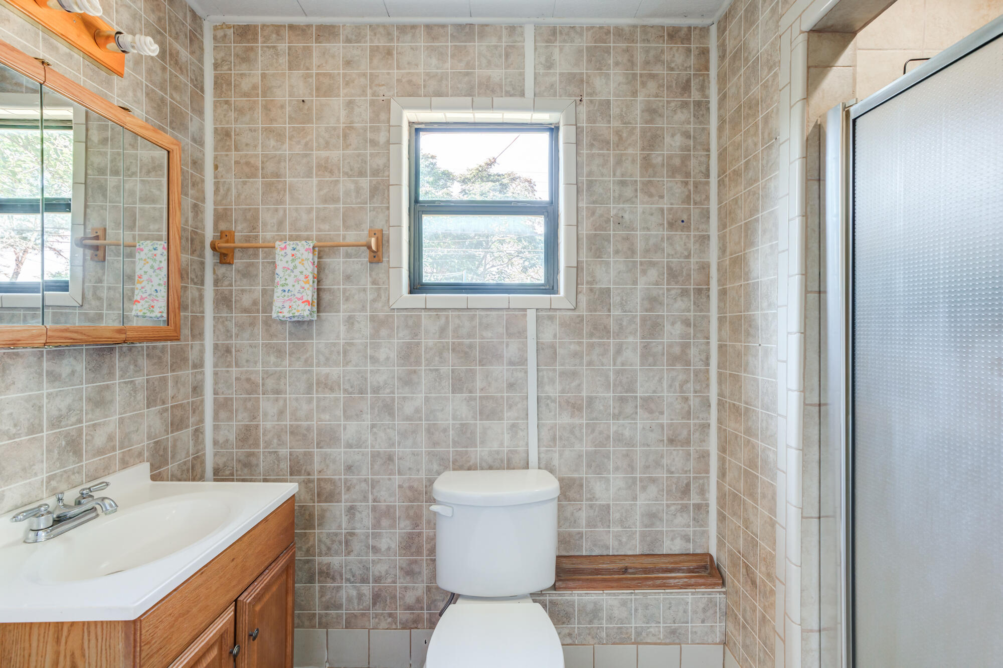 2019 40th Street Lubbock, TX 79412 - Photo 21 of 33 a bathroom with a sink a toilet and shower