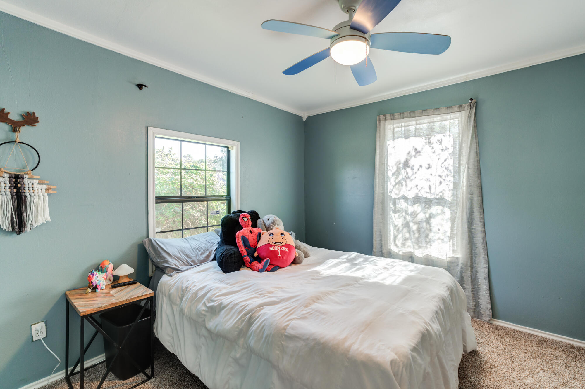2019 40th Street Lubbock, TX 79412 - Photo 23 of 33 a bedroom with a bed and a window