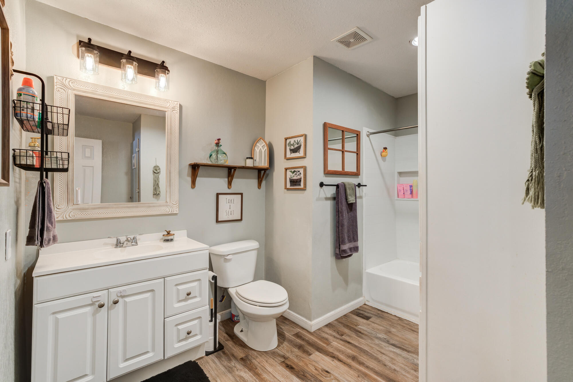 2019 40th Street Lubbock, TX 79412 - Photo 24 of 33 a bathroom with a toilet sink and shower