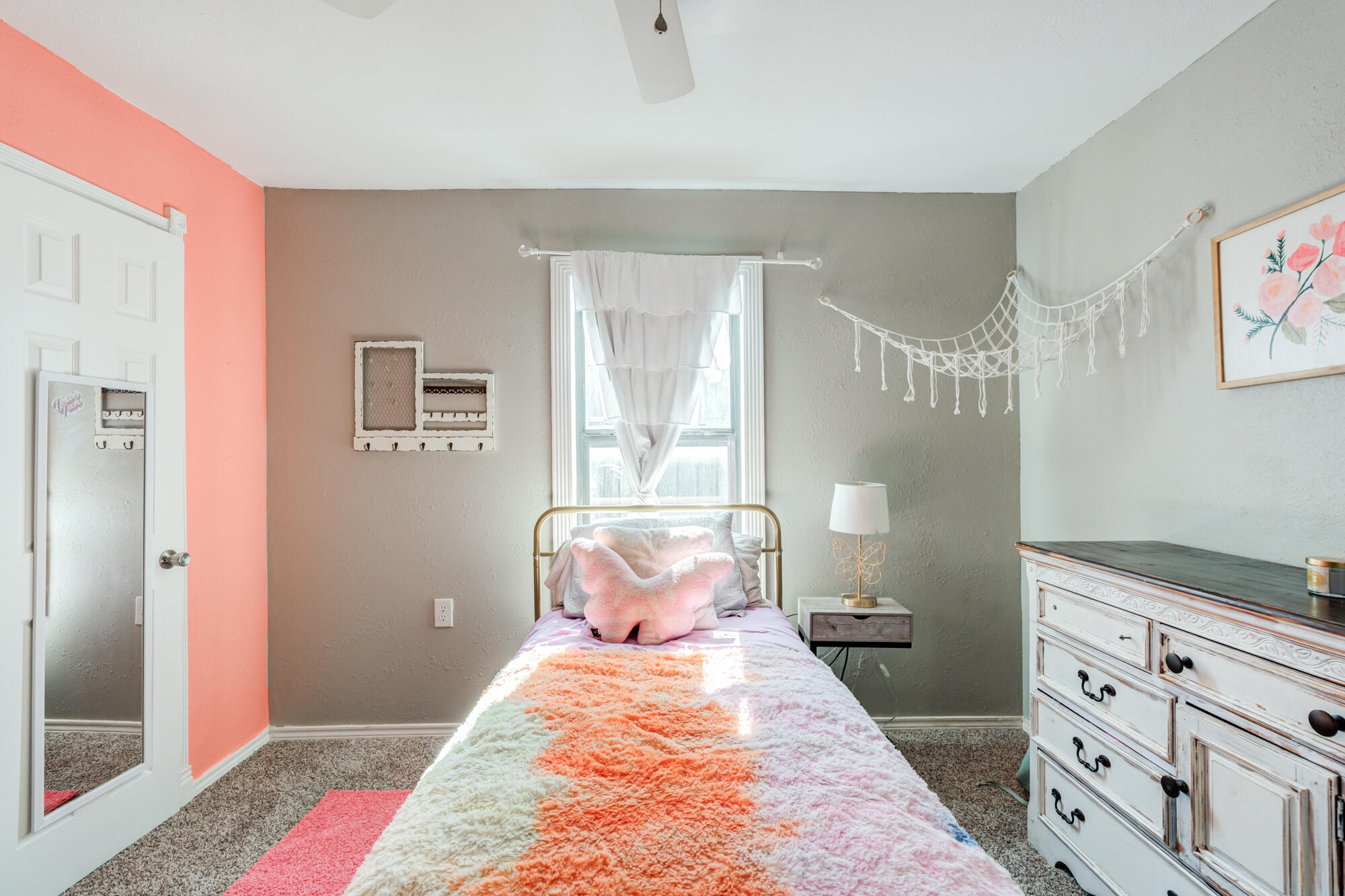 2019 40th Street Lubbock, TX 79412 - Photo 27 of 33 a bed room with a bed and a dresser
