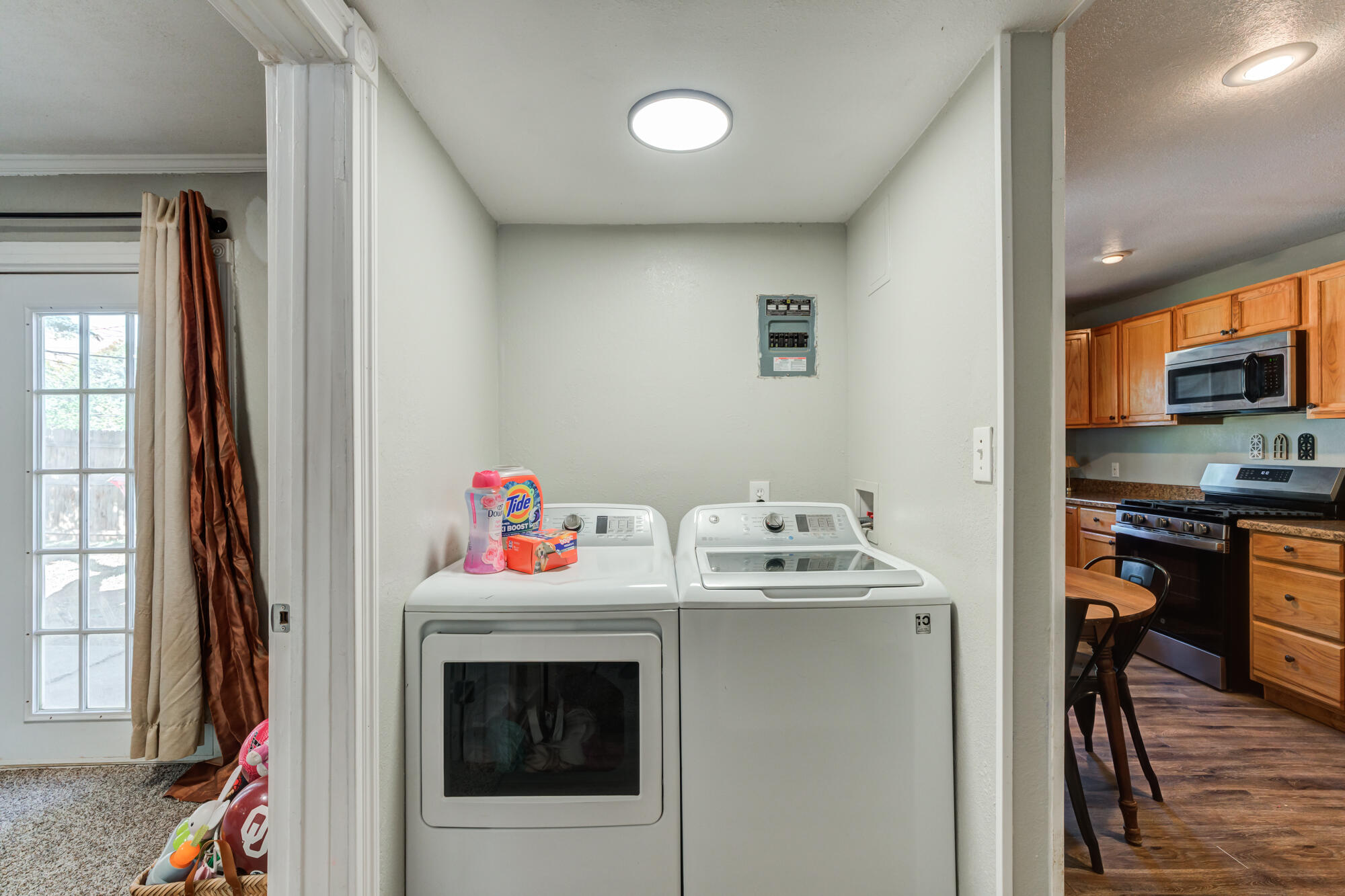 2019 40th Street Lubbock, TX 79412 - Photo 28 of 33 a utility room with stainless steel appliances granite countertop a stove and a sink