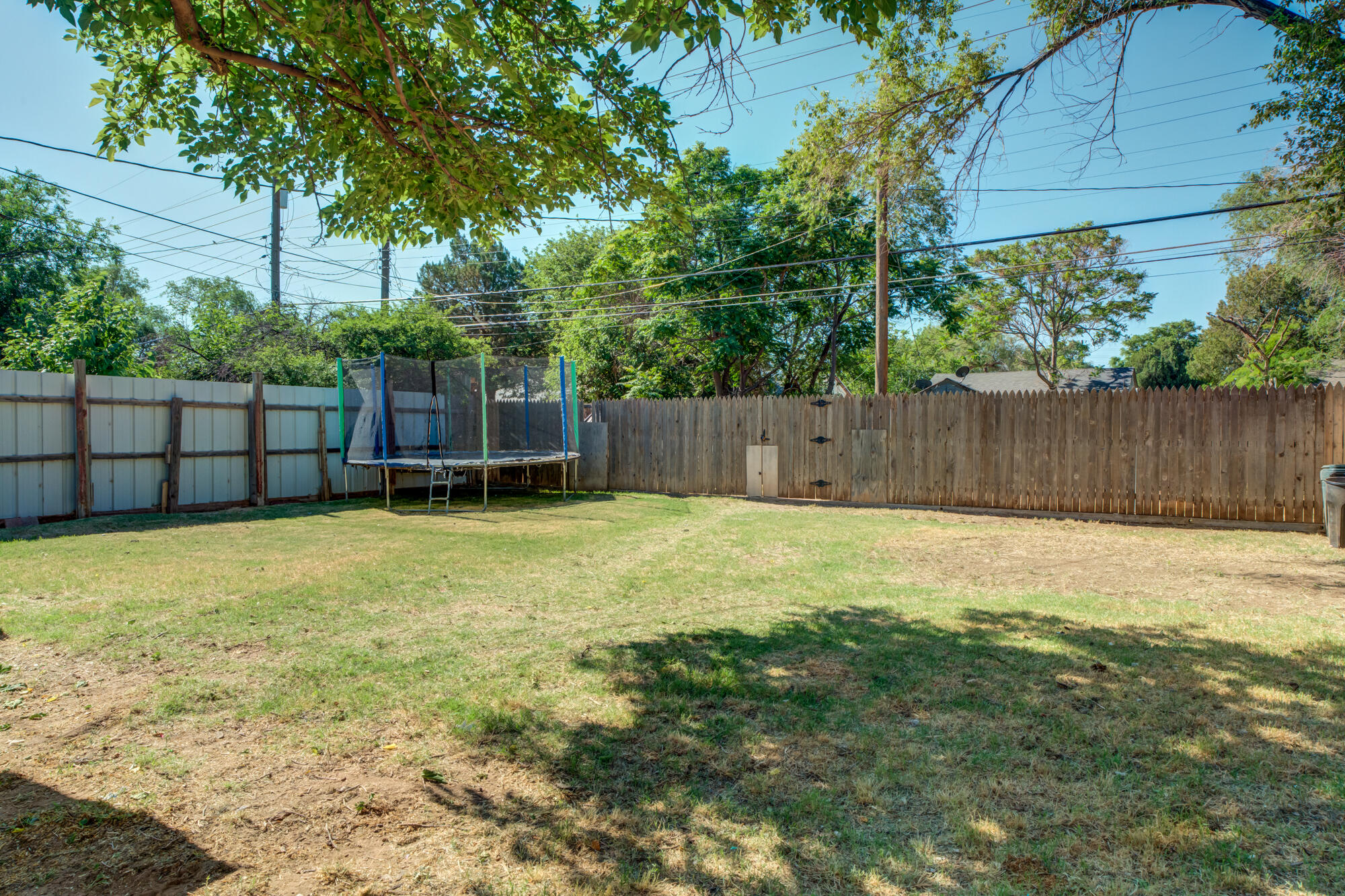 2019 40th Street Lubbock, TX 79412 - Photo 32 of 33 a view of a backyard with a small cabin