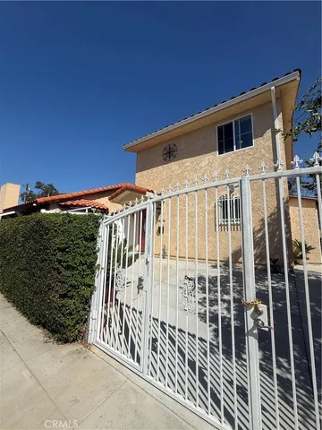 a view of a house with a small yard