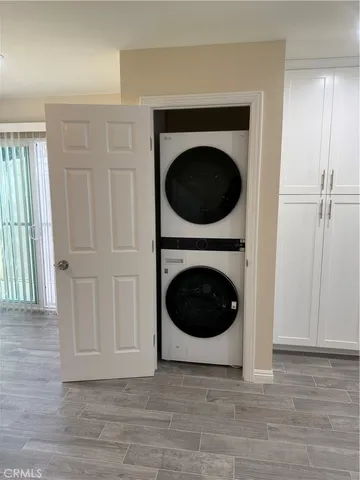 a view of a hallway with washer and dryer