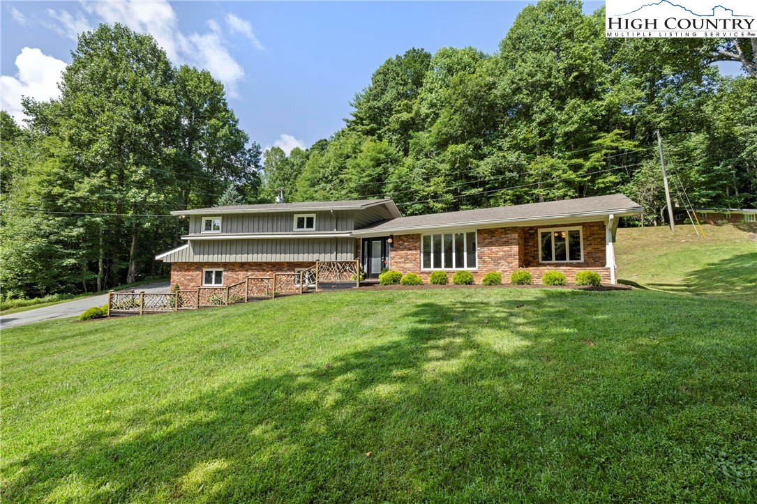 956 Jordan V Cook Road Boone, NC 28607 - Photo 3 of 50 a front view of a house with a garden