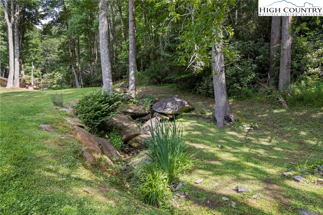 956 Jordan V Cook Road Boone, NC 28607 - Photo 42 of 50 a backyard of a house with lots of green space