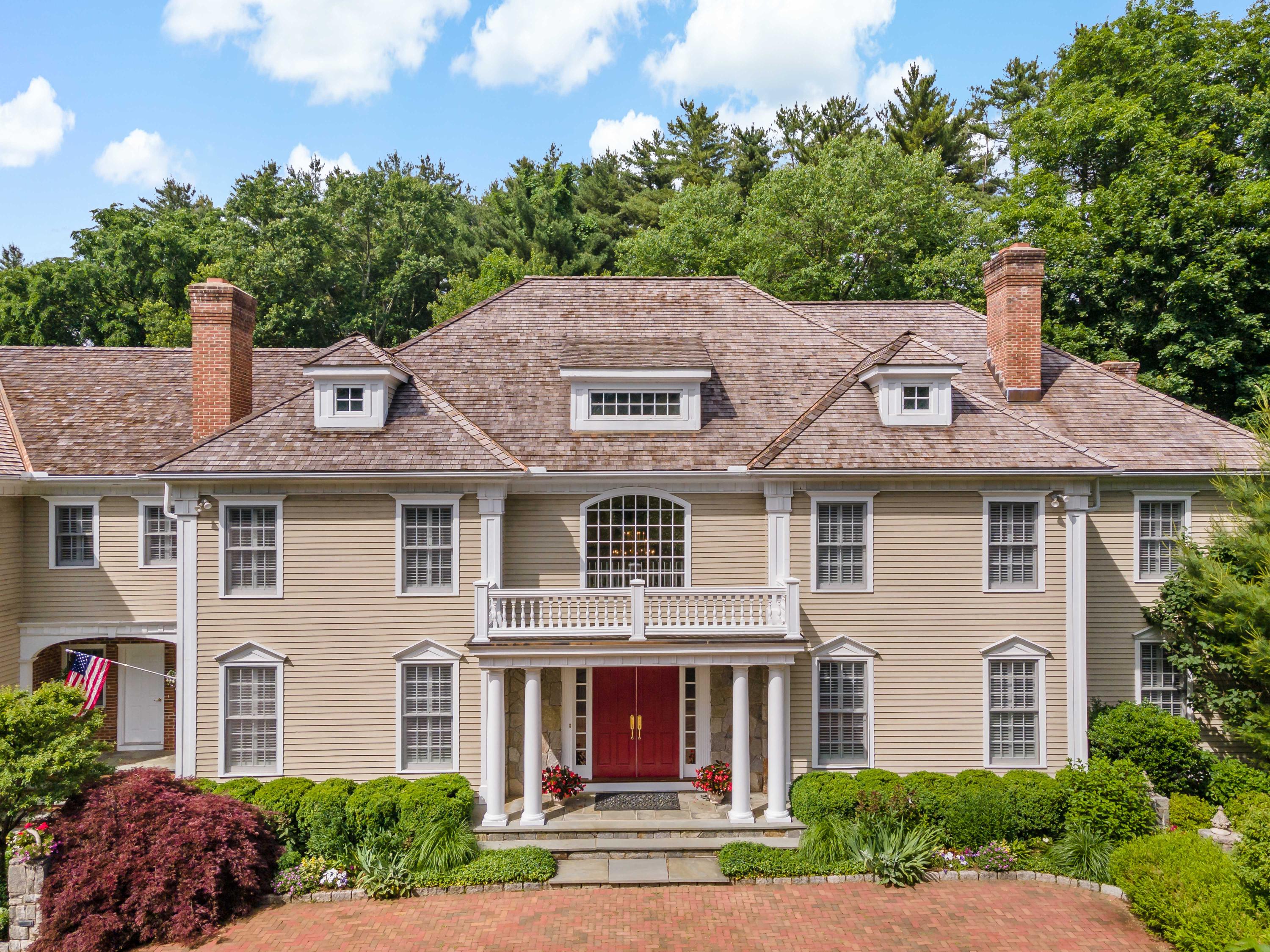 318 Ridgefield Road Wilton, CT 06897 - Photo 1 of 51 front view of a house with a yard