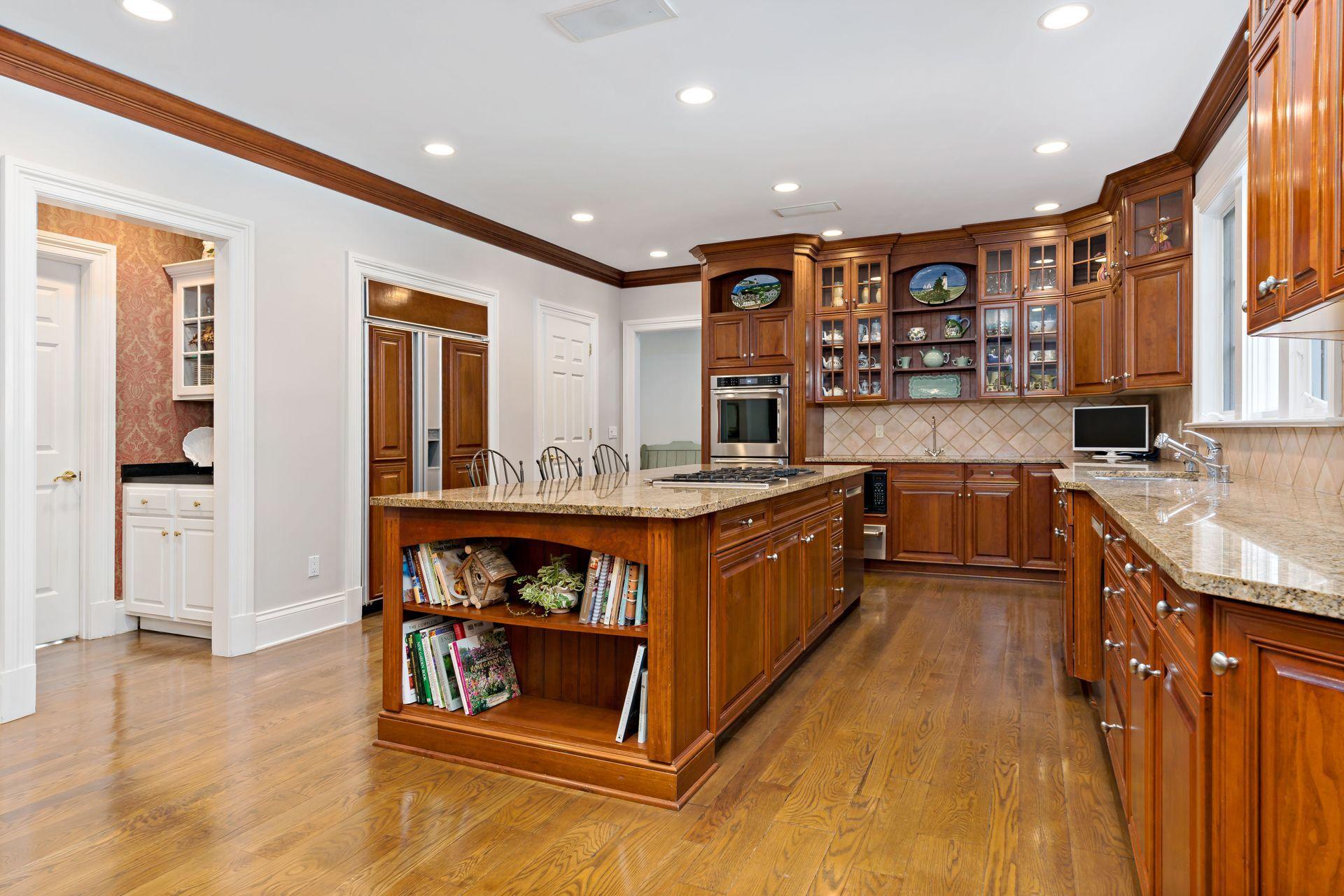 318 Ridgefield Road Wilton, CT 06897 - Photo 16 of 51 a large kitchen with stainless steel appliances granite countertop a large stove a sink and a refrigerator