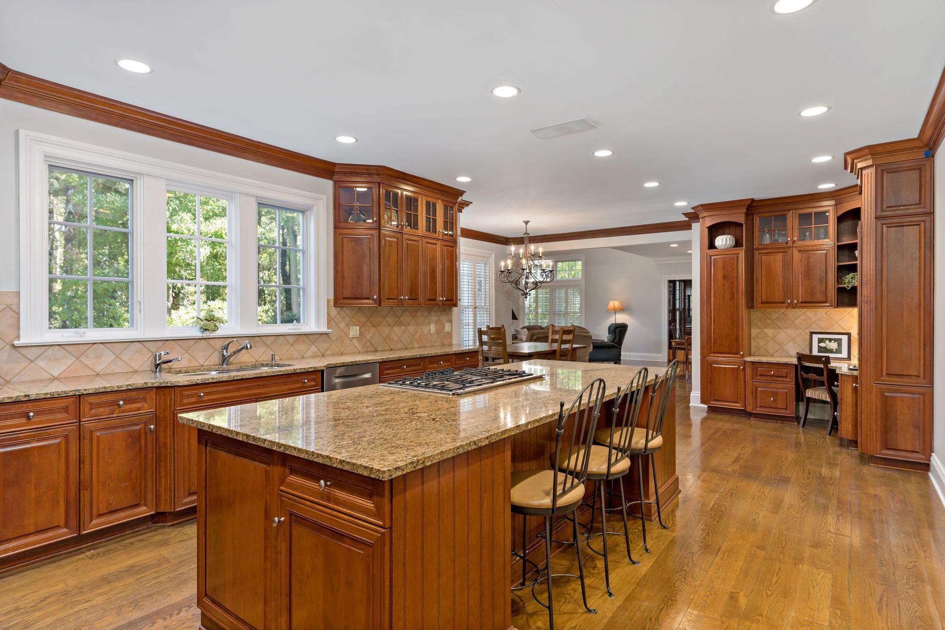 318 Ridgefield Road Wilton, CT 06897 - Photo 19 of 51 a kitchen with a table chairs sink and wooden floor