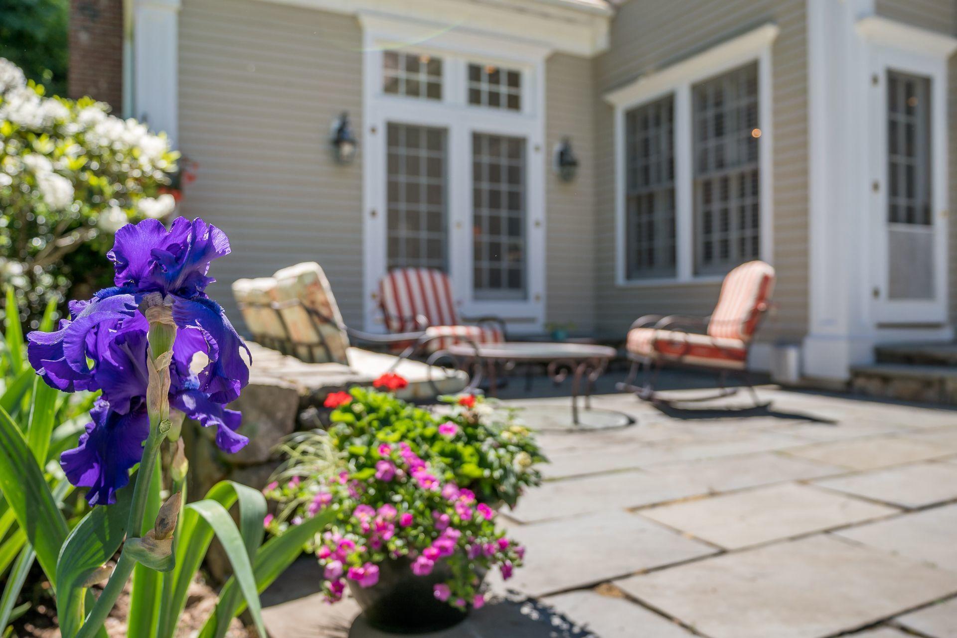 318 Ridgefield Road Wilton, CT 06897 - Photo 24 of 51 a front view of a house with outdoor seating