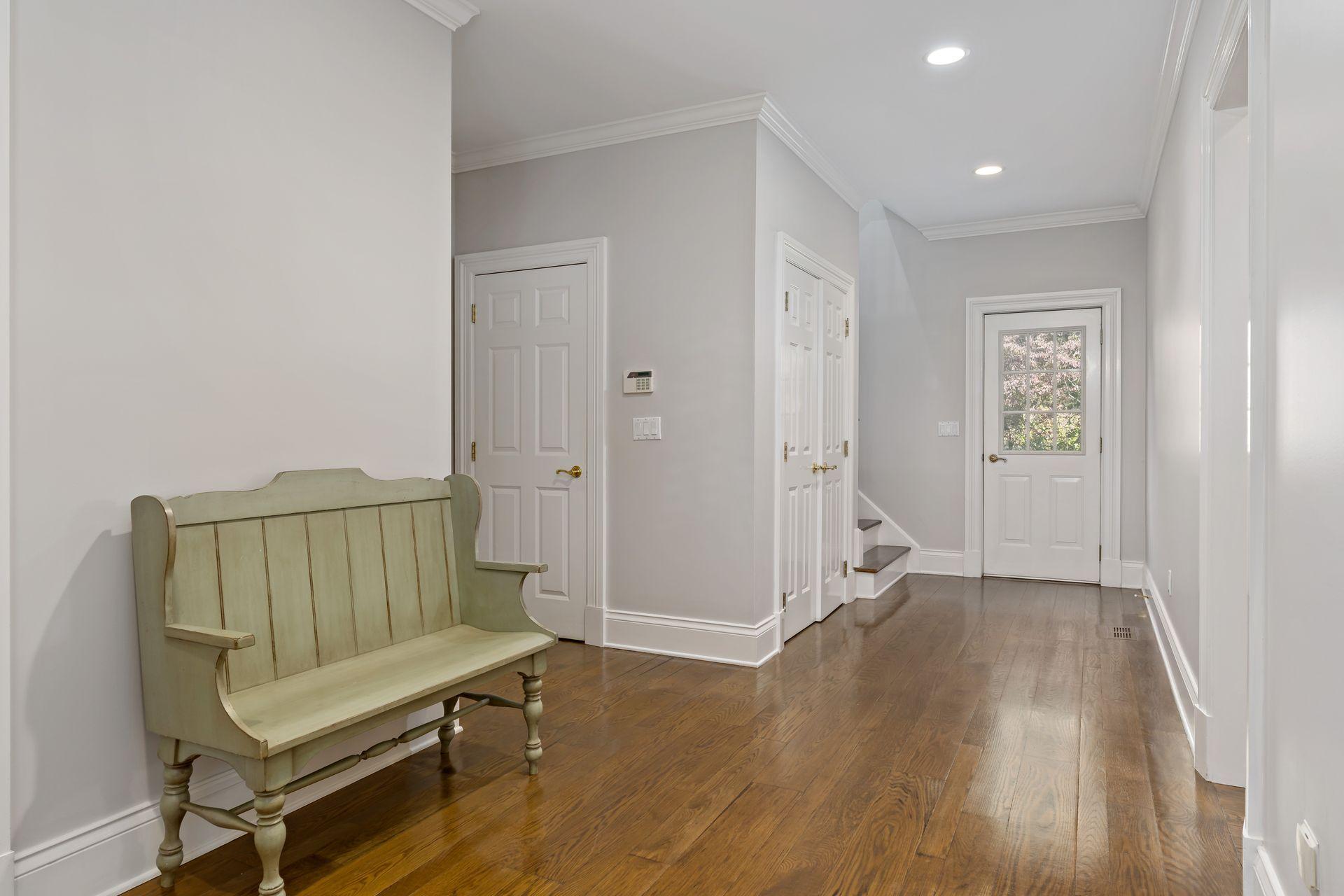 318 Ridgefield Road Wilton, CT 06897 - Photo 25 of 51 an empty room with wooden floor and a rug