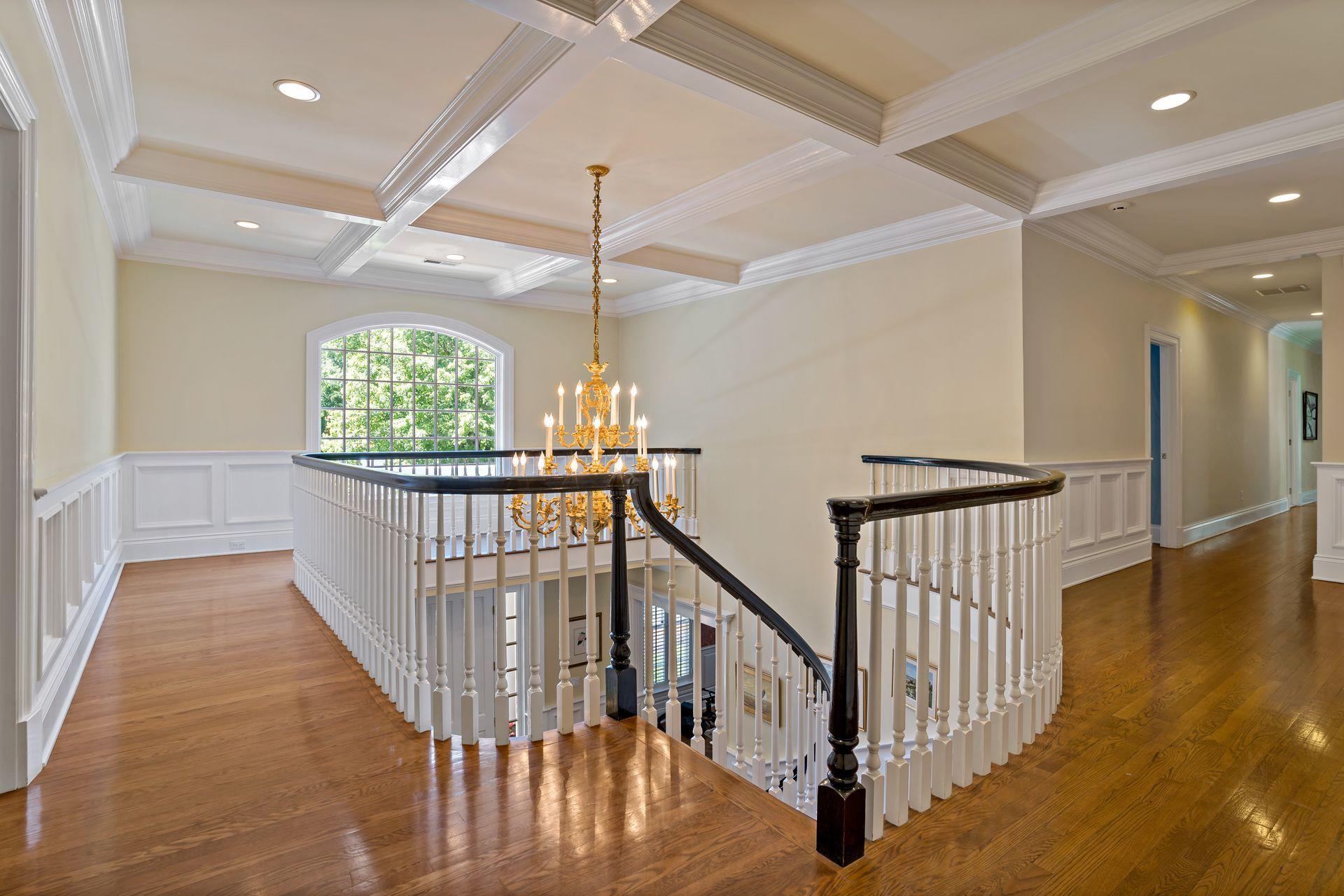 318 Ridgefield Road Wilton, CT 06897 - Photo 28 of 51 wooden floor with staircase and windows