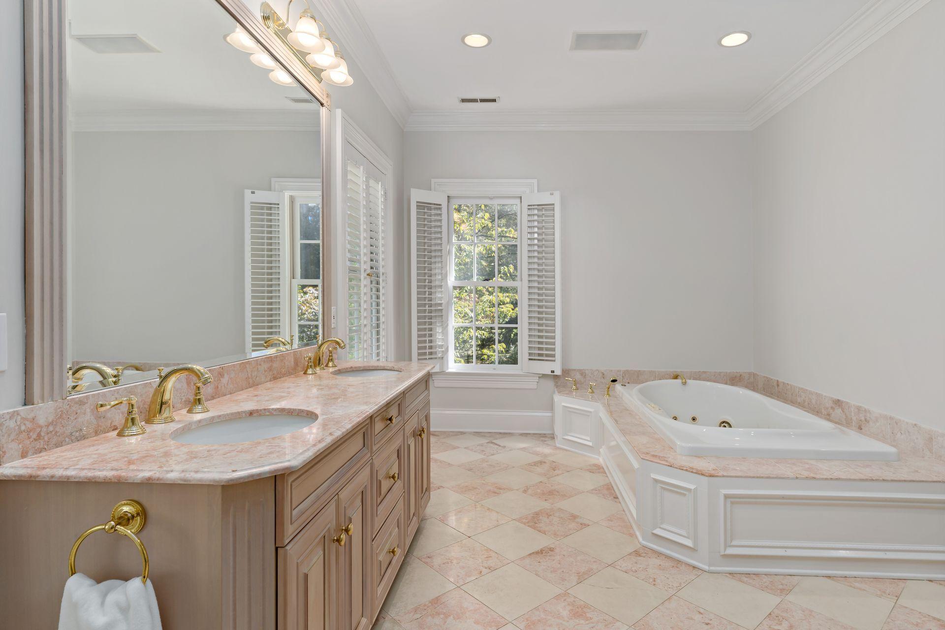 318 Ridgefield Road Wilton, CT 06897 - Photo 31 of 51 a bathroom with a tub sink and mirror