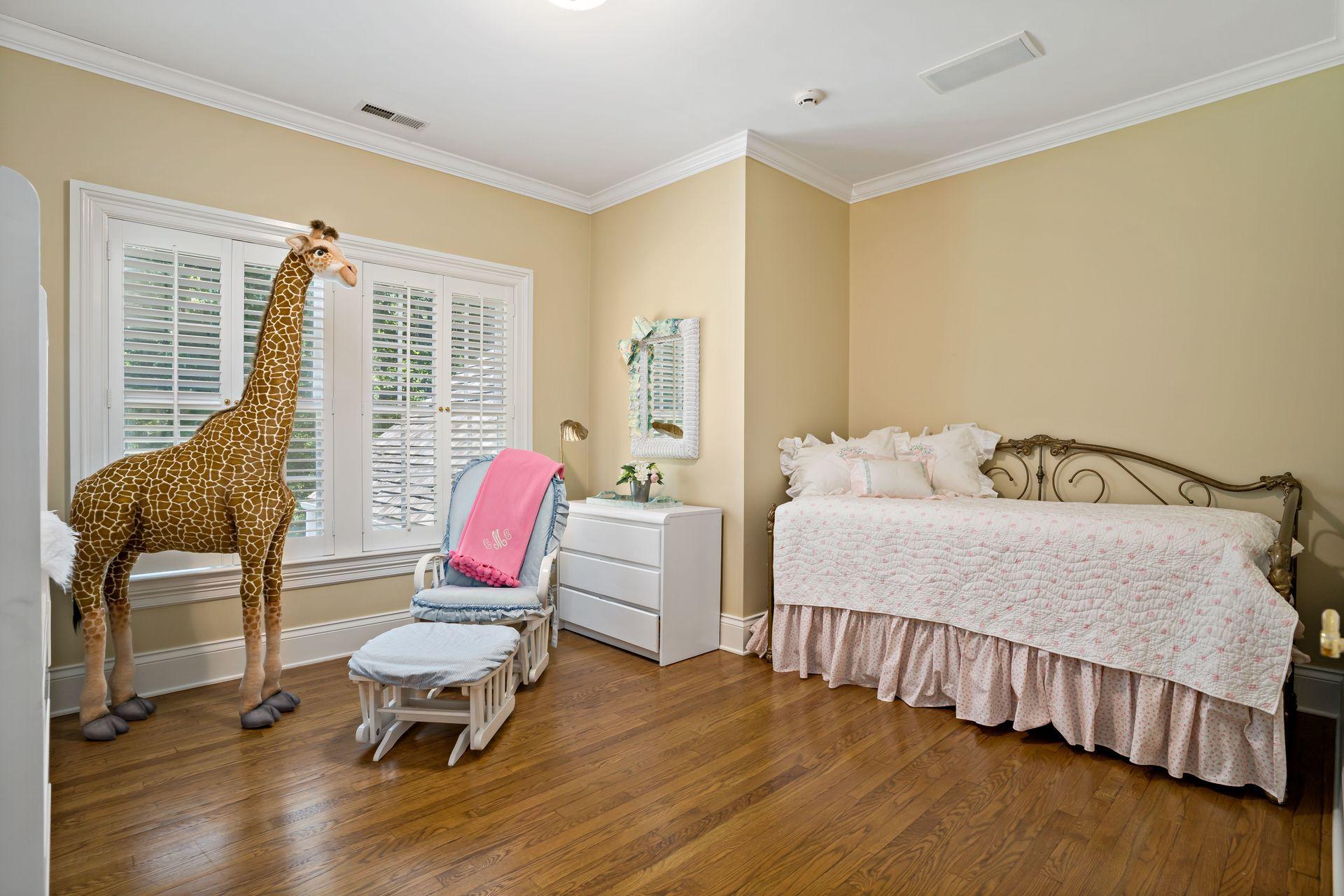 318 Ridgefield Road Wilton, CT 06897 - Photo 34 of 51 a bedroom with a bed chair and window