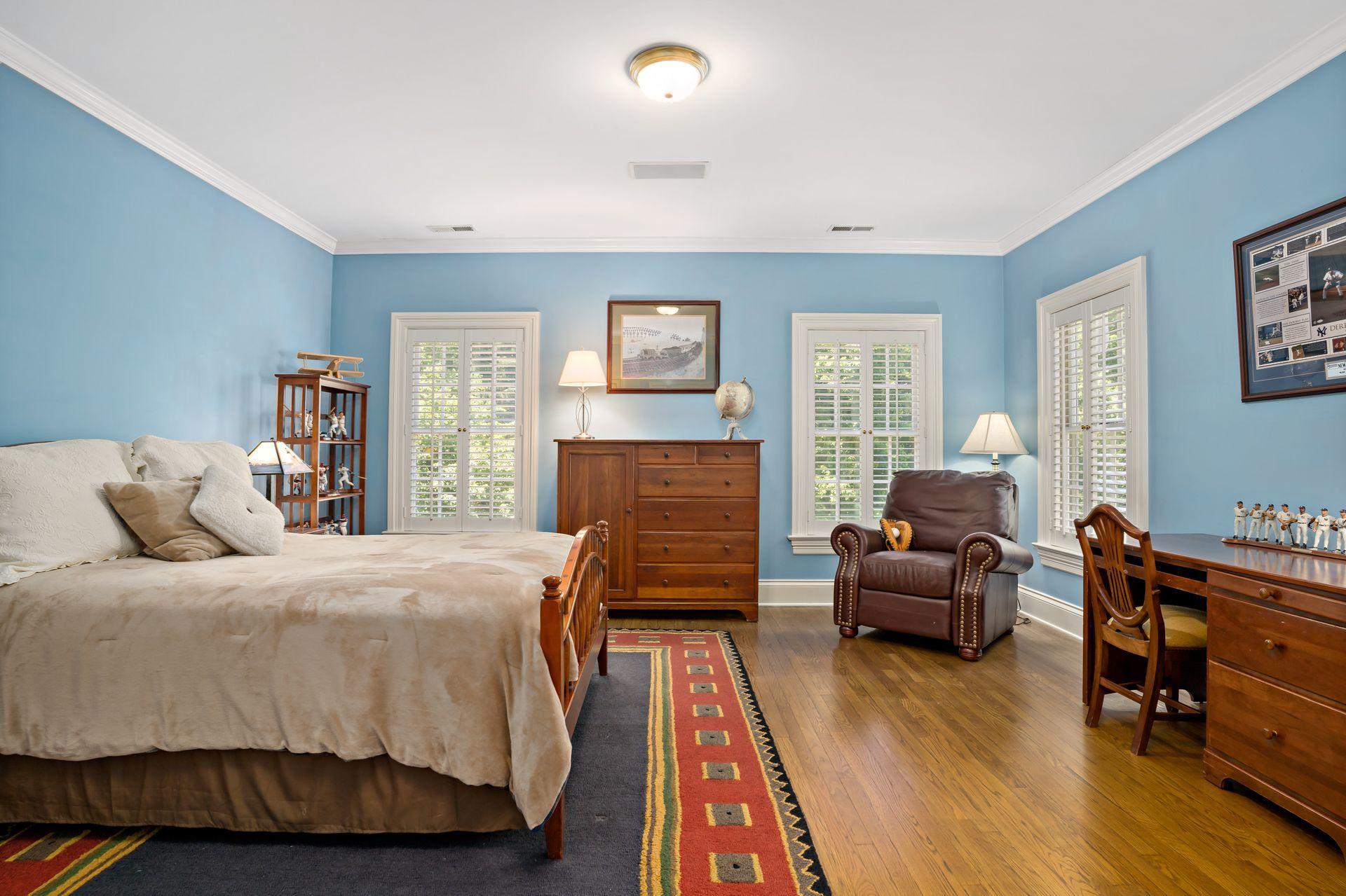 318 Ridgefield Road Wilton, CT 06897 - Photo 35 of 51 a bedroom with a bed and wooden floor