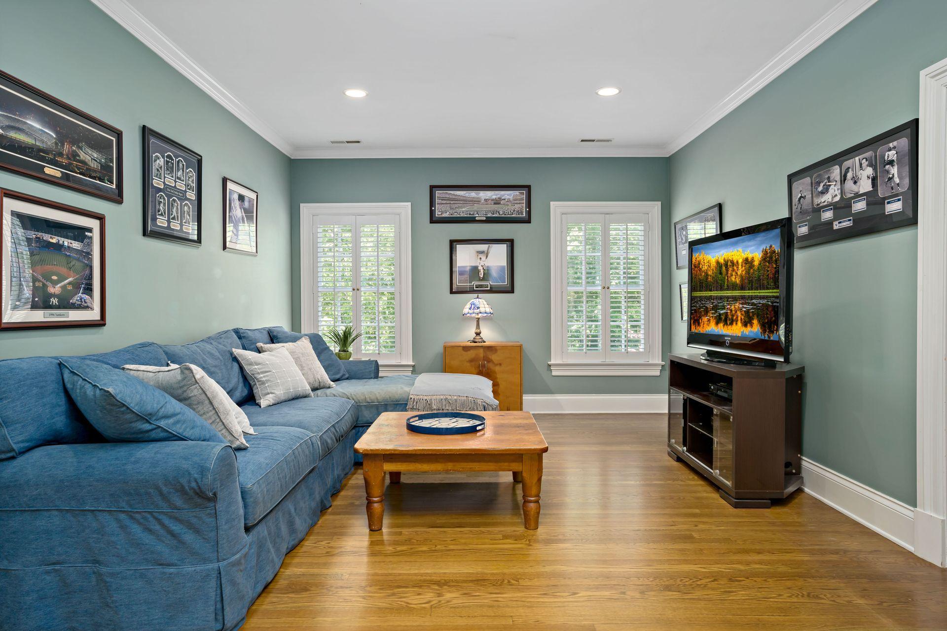 318 Ridgefield Road Wilton, CT 06897 - Photo 38 of 51 a living room with furniture and a flat screen tv