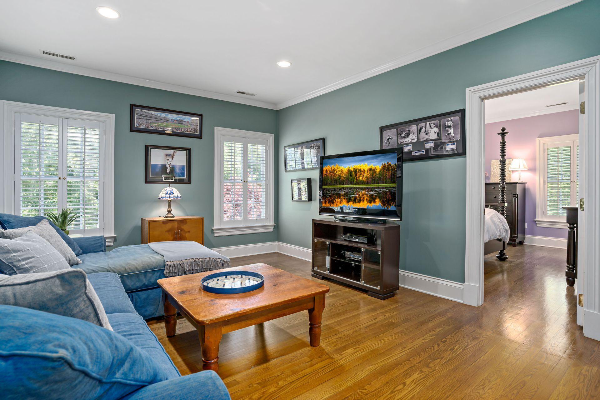 318 Ridgefield Road Wilton, CT 06897 - Photo 39 of 51 a living room with furniture and a flat screen tv