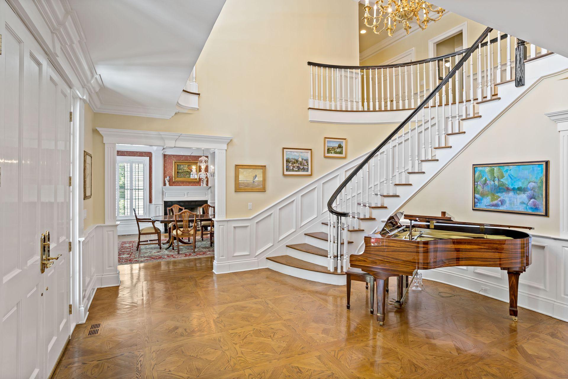 318 Ridgefield Road Wilton, CT 06897 - Photo 5 of 51 a view of staircase with lots of frames and couches