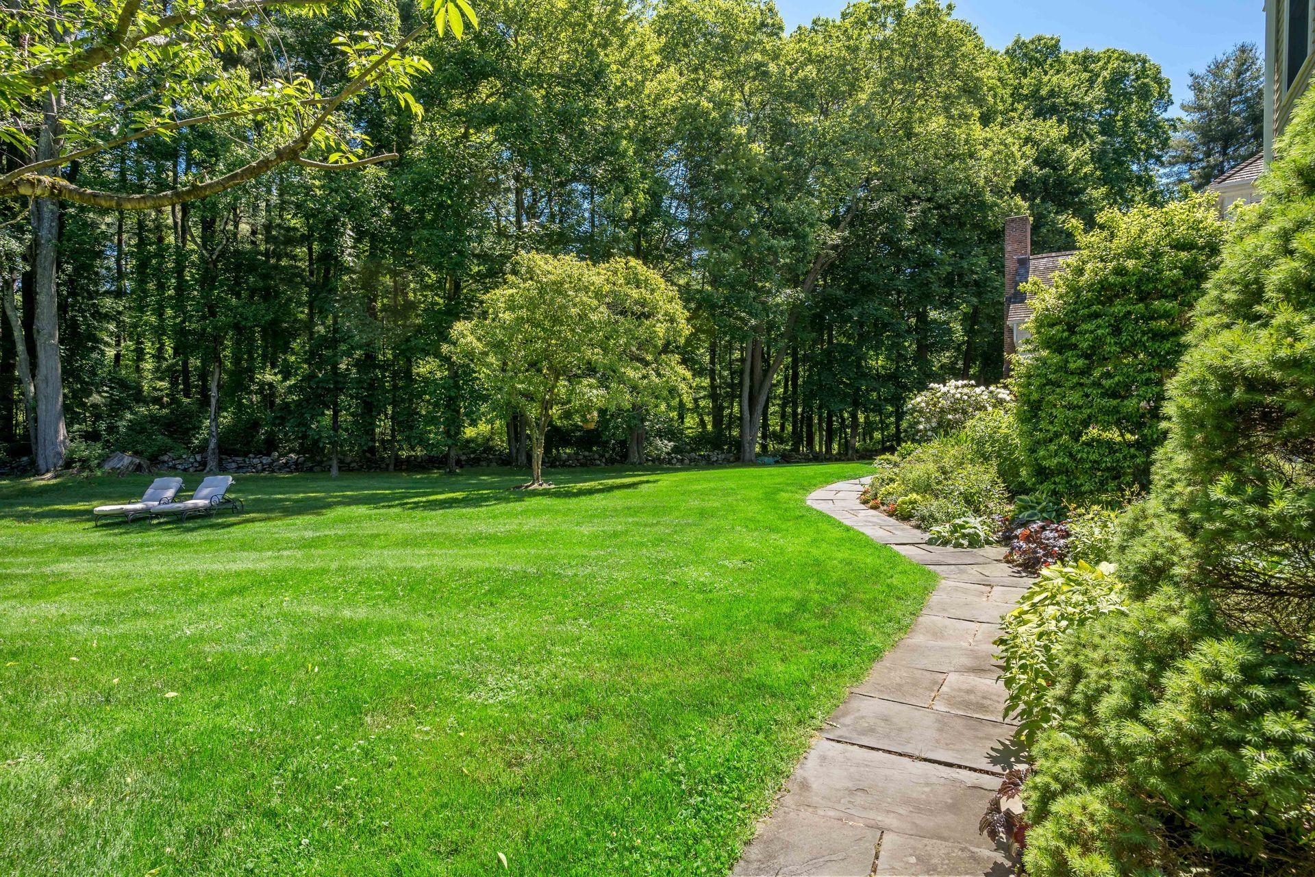 318 Ridgefield Road Wilton, CT 06897 - Photo 48 of 51 a view of a garden with a tree
