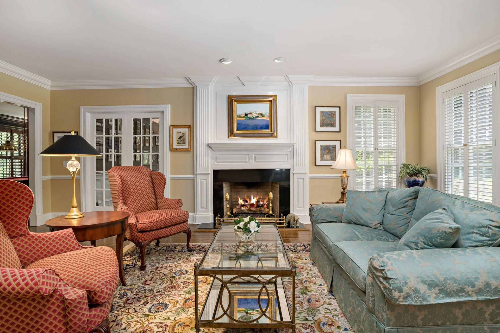 318 Ridgefield Road Wilton, CT 06897 - Photo 7 of 51 a living room with furniture and a fireplace