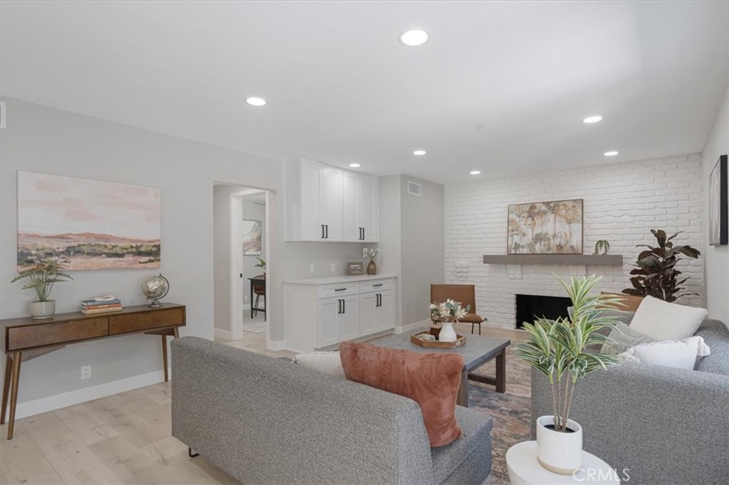 25032 Crystal Circle Lake Forest, CA 92630 - Photo 16 of 54 a living room with furniture and a fireplace