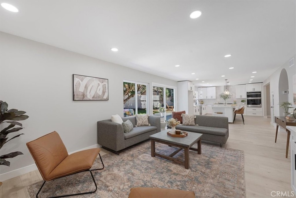 25032 Crystal Circle Lake Forest, CA 92630 - Photo 17 of 54 a living room with furniture and a table