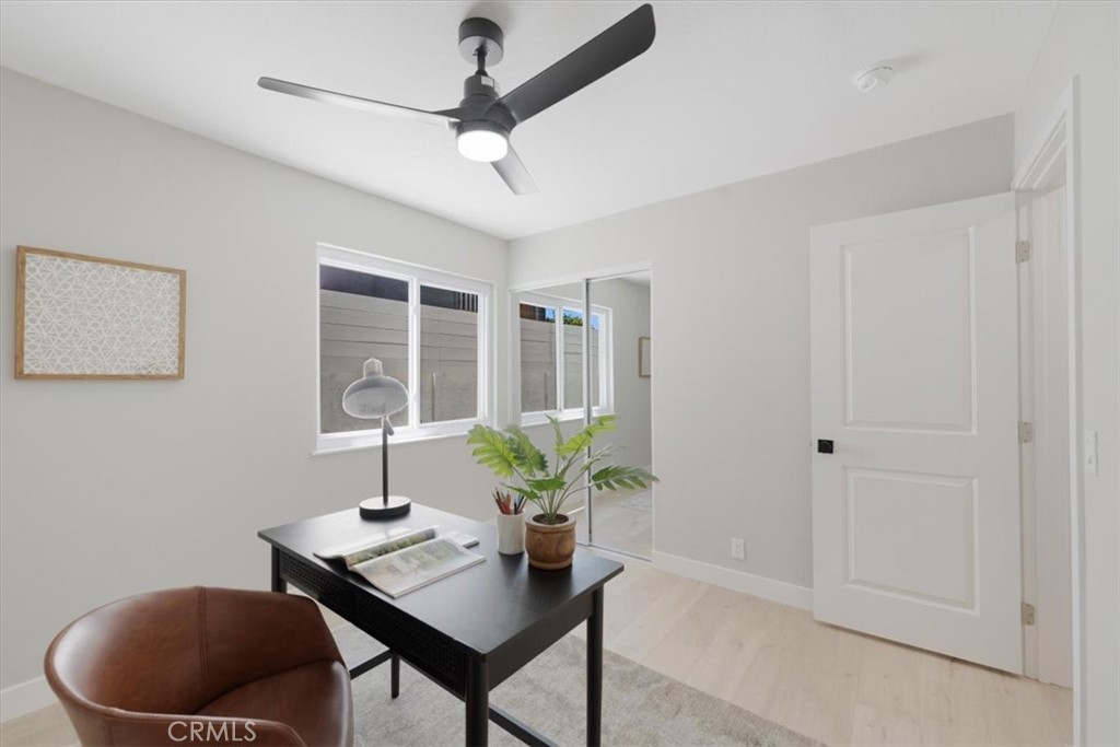 25032 Crystal Circle Lake Forest, CA 92630 - Photo 19 of 54 a view of a workspace with furniture and a potted plant