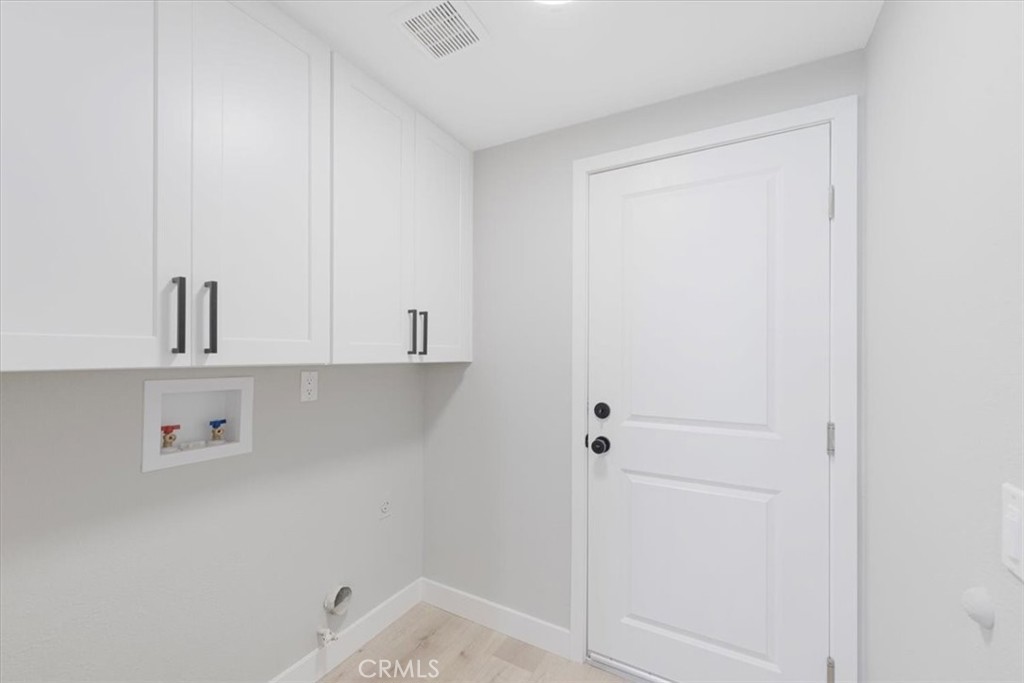 25032 Crystal Circle Lake Forest, CA 92630 - Photo 22 of 54 a view of storage and utility room with washer and dryer