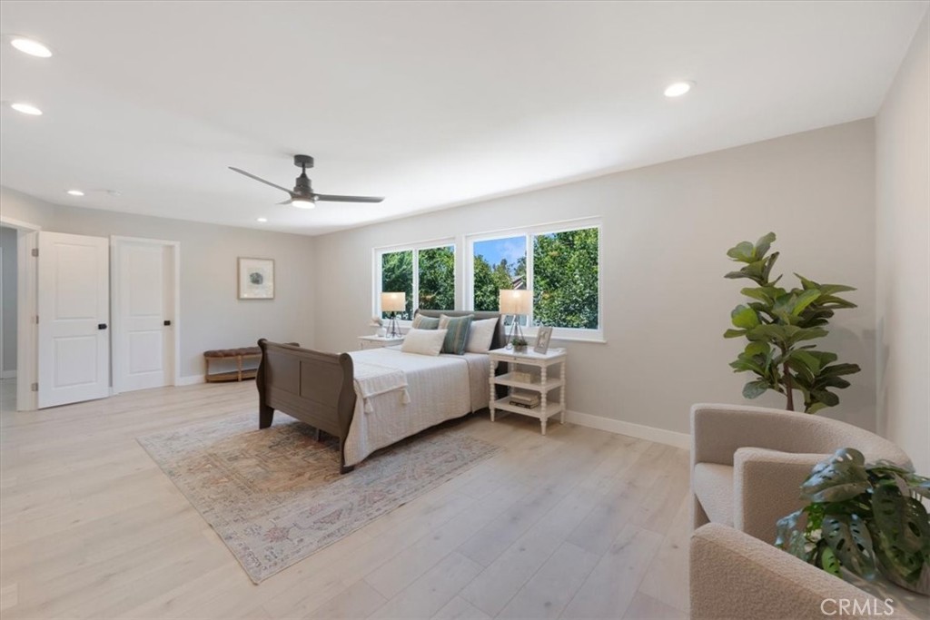 25032 Crystal Circle Lake Forest, CA 92630 - Photo 25 of 54 a living room with furniture and a potted plant