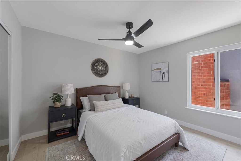 25032 Crystal Circle Lake Forest, CA 92630 - Photo 31 of 54 a bedroom with a bed and a window