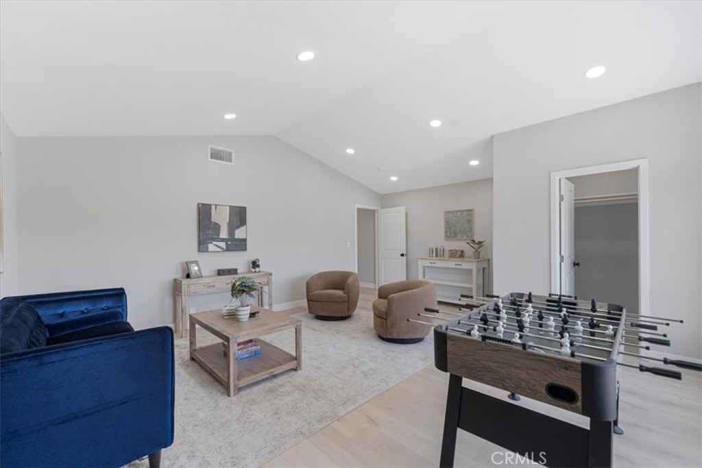 25032 Crystal Circle Lake Forest, CA 92630 - Photo 36 of 54 a living room with furniture and wooden floor